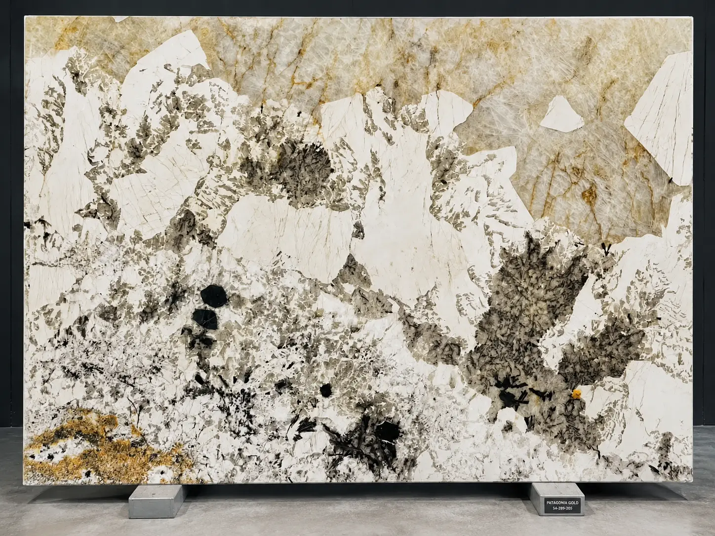 Patagonia Gold Granite slab with champagne feldspar and dark crystals